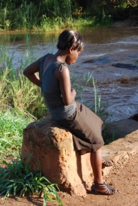 My niece Ruth Tembo waiting for a bus near our village on our return to Lusaka in December 2011