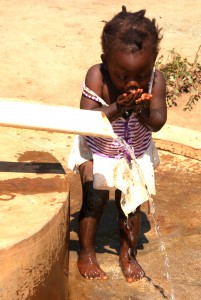 Kukaya is where children drink fresh clean water from a hand driven borehole pump.