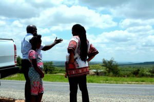 Mwizenge Tembo admiring the beautiful valley, while Temwani Banda and Mulenga Kapwepwe look on.