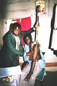 A traditional healer or ng'anga diagnosing a patient who had chronic pain in his shoulder and arm.
