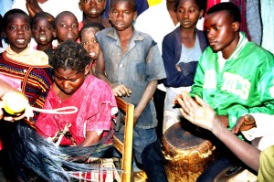 The young girl in the chair (left) is a patient performing the Vimbuza Dance to exorcise spirits that are believed to come from no where.
